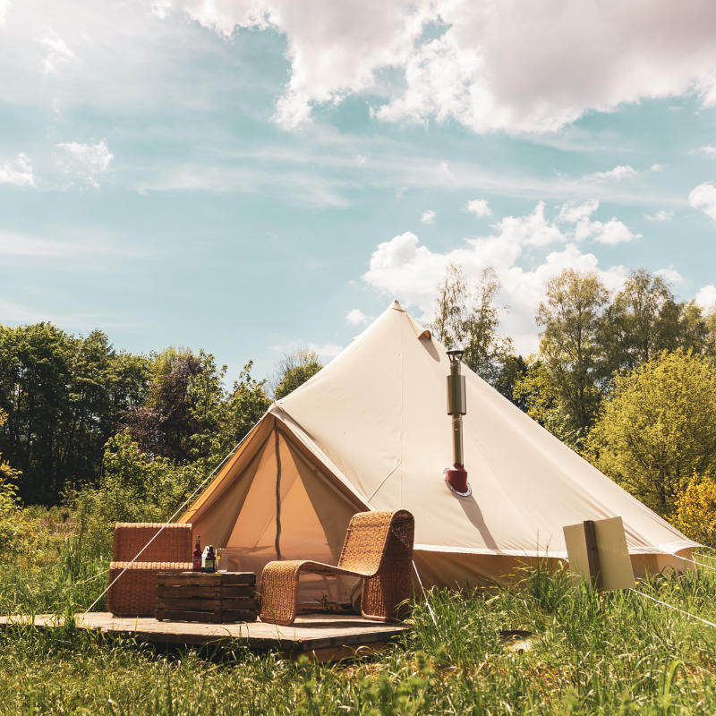 Yurt Tent Sibley Pro 500 by Canvas Camp front left view on wood deck in grassy field