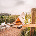 Yurt Tent Sibley Ultimate 450 by Canvas Camp front left view in cornfield on wood chips at campsite