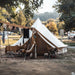 Yurt Tent Sibley Ultimate 500 by Canvas Camp front view at campsite with hanging clothes table and chairs