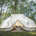 Yurt Tent Sibley Ultimate 600 twin by Canvas Camp on grass by trees in forest with bed inside