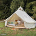 Yurt Tent Stella Stargazer by Life in Tents 13ft front left view on grass near trees with home door mat