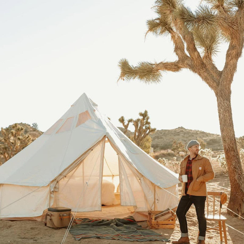 Yurt Tent Stella Stargazer by Life in Tents in desert with man drinking coffee