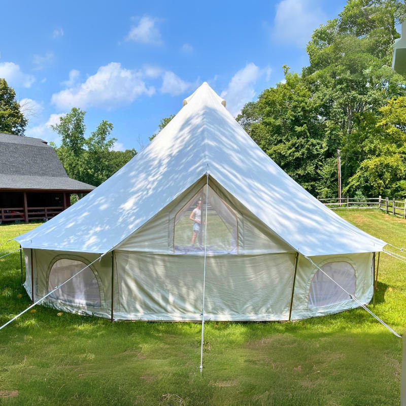 Yurt Tent Zephyr by Life in Tents 16ft rear view on grass woman in background