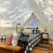Yurt Tent Zephyr by Life in Tents 19ft interior plaid blanket on bed and wood chair