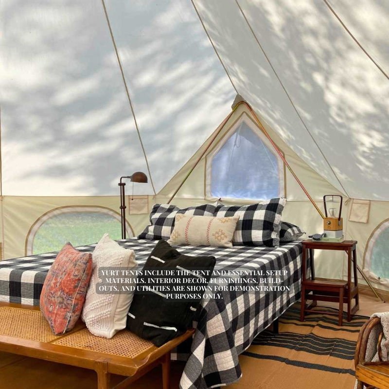 Yurt Tent Zephyr by Life in Tents 19ft interior plaid blanket on bed and wood chair